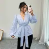Moda europea y americana para mujer transfronteriza súper ventas primavera y otoño nueva elegante sexy semitransparente manga larga cuello en V camisa para mujer