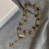 Collar Colgante Gota de Agua Piedra Ojo de Tigre Maillard Estilo Hong Kong Moda Versátil Cadena para Suéter Joyería de Nicho Venta al por Mayor