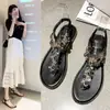 Sandalias Romanas para Mujer, Verano 2026 Nuevas Versátiles Estilo Hada Elegantes Planas Chanclas de Pedrería Zapatos de Playa