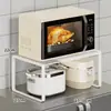 Estante de cocina multifuncional expandible, una herramienta mágica para encimera para uso doméstico, estante de almacenamiento encima del microondas y el refrigerador