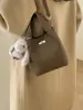 Bolso Cubo Portátil de Nicho Estilo Coreano para Mujer Primavera 2026 Nuevo Retro de Alta Calidad Casual Bandolera