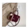 Moda de textura transfronteriza nicho bolso cubo bolso de mujer 2026 nuevo otoño retro simple bolso de hombro bolso cruzado moderno