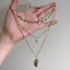 Collar con Colgante de Corazón de Perlas de Múltiples Capas Nuevo Transfronterizo Ins de Aspecto Alto Único Creativo Cadena para Clavícula Que Puede Guardar Fotos