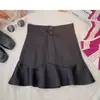 Falda corta casual de moda línea A para mujer cintura alta adelgazante petite talla extra pierna ancha cubriendo carne estilo callejero dulce persona moderna falda de longitud media