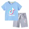 Camiseta infantil 2022 TikTok verano nueva ropa infantil de comercio exterior coreana pantalones cortos de manga corta para niños traje de dos piezas