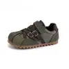 Zapatillas de entrenamiento alemanas para niños 2026 primavera y otoño nuevas zapatillas deportivas de suela plana, zapatillas versátiles casuales con hebilla y colores contrastantes, estilo Forrest Gump