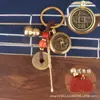 Llavero Zodiacal de Latón Cadena Decorativa Giratoria Juego de Cuatro Piezas con Cuerda de Nube Auspiciosa Vintage de Cinabrio y Monedas de los Cinco Emperadores para la Buena Fortuna