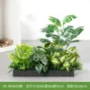 Simulação de paisagismo com plantas verdes jardineira floreira combinação de display flores artificiais biônicas decoração de paisagem interna divisória de planta tropical