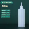Venta al por mayor de fábrica botella de color tinte pintado de 500 ml botella dispensadora de apretar botella de plástico semitransparente botella de aguja