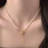 Collar minimalista y elegante de estilo coreano con perla geométrica de circón, cadena para la clavícula de lujo ligero y de alta gama, joyería de nicho moderna y exquisita