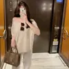 En stock + calidad originalCamiseta de punto de manga corta off-shoulder para mujer, top de verano holgado con protección solar
