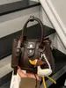 Bolso de mano pequeño transfronterizo para mujer, nuevo bolso de hombro texturizado de moda de verano 2026, bolso cruzado tipo cubo para el trabajo
