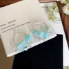 Pendientes de Flor Geométrica de Cristal Azul Fresco Nicho para Mujer Lujo Ligero Sensación de Alta Gama Pendientes de Botón Moda Versátil Joyería para Orejas