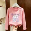 Camiseta casual de algodón puro para niñas, cuello redondo, manga larga, nuevo estilo fino de primavera y otoño 2026, top versátil de dibujos animados para niños mayores