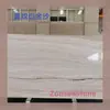 El mármol con veta recta y vetas de oro blanco se puede proporcionar como muestras y se puede procesar para crear diversos acabados superficiales, como la superficie de piña pulida a mano.