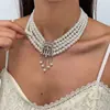 Collar multicapa de perlas de vidrio con incrustaciones de diamantes, estilo vintage europeo y americano, cadena para la clavícula de nicho de alta gama, joyería de moda de lujo ligero para mujer