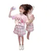 Conjunto de Verano 2026 para Niñas, Conjunto Estilo Universitario para Niñas de Primaria, Camiseta de Cuello Redondo, Falda Corta a Cuadros, Conjunto de Dos Piezas de Dibujos Animados