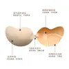 Los protectores de senos adhesivos con forma de mango son personalizables, ligeros, transpirables, hipoalergénicos e invisibles, adecuados para vestidos de novia, haciendo que los pechos pequeños parezcan más grandes