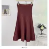 Falda de punto simple casual de color liso estilo coreano, nueva de otoño 2026, de cintura alta, corte ajustado, línea A, recta