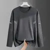 Camiseta casual versátil de manga larga para hombre para otoño, cuello redondo, color liso moderno, cómoda, transpirable y de corte holgado.