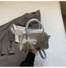 Bolso de mujer de primavera 2025, diseño de nicho de moda, informal, sencillo, pequeño, cuadrado, bolso de mano, bandolera de hombro.
