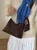 Bolsa de Mão Estilo Coreano Nicho Retrô para Dumpling Feminina Outono/Inverno 2026 Nova Veludo Versátil Casual Ombro Transversal