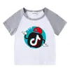 2026 Nova Roupa Infantil Verão Camiseta de Manga Curta para Meninos e Meninas, Camiseta Base Raglan, Camiseta de Meia Manga para Bebê, Top Infantil