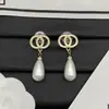 Suministro Exclusivo Transfronterizo de los Nuevos Pendientes de Perla Gotas de Agua Brillantes Doble C de Chanel para Mujer, Pendientes de Aguja de Plata de Alta Calidad, Réplica Exacta, Venta al por Mayor