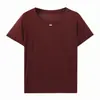 Nueva camiseta popular de verano para mujer, color liso, cuello redondo, suéter con colgante ovalado, manga corta, top casual y holgado
