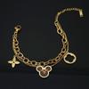 Pulseira de aço inoxidável e couro de camada dupla moda europeia e americana transfronteiriça pulseira Mickey mouse trevo de quatro folhas de titânio dourado 18K para mulheres