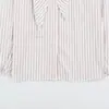 Ropa de mujer transfronteriza al por mayor 2026 otoño nuevo estilo europeo y americano versátil lazo hombreras acolchadas camisa a rayas 4764031