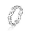 Anillo de acero de titanio con diseño creativo de flores, venta caliente transfronteriza, para mujer, resistente a la decoloración, anillo hueco liso de nicho, fabricante de anillos