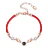 Un ciervo tiene tu pulsera de pareja de proyección 100 idiomas versión coreana de joyería simple pulsera de cuerda roja con pequeñas astas