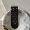 Serie Gris de Alta Inteligencia Songmu: Calcetines grises sofisticados y discretos para mujer con lazo estilo ins y diseño apilado