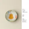Diseño floral pintado a mano en una pequeña taza de té de cerámica con forma de mandarina verde, con el diseño "Fuyu Fulu Qiankun", una taza de té de cerámica creativa, una sola taza, una taza de maestro, una taza de té
