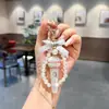 Chaveiro Formato Microfone Cheio de Strass Laço com Pérolas Pingente de Microfone Criativo Fonte Atacadista