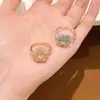 Popular en Xiaohongshu: Pulsera de camelia con circonita de diamante completo ultra brillante para mujer, de alta gama, elegante, versátil, anillo ajustable