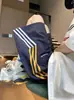 Marca de moda de estilo americano con tres rayas, secado rápido, finos, shorts deportivos de verano para hombres y mujeres, elegantes shorts de cinco puntos de estilo callejero