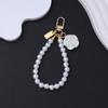 Chaveiro Pingente de Rosa com Laço Corrente de Contas de Pérola Ornamento Pendente para Bolsa/Estojo de Fone de Ouvido/Celular Anti-Perda para Menina