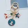 Llavero de Astronauta Planeta de Dibujos Animados al por Mayor Estrellas Lindas Cohete Spaceman Colgante para Coche Regalo