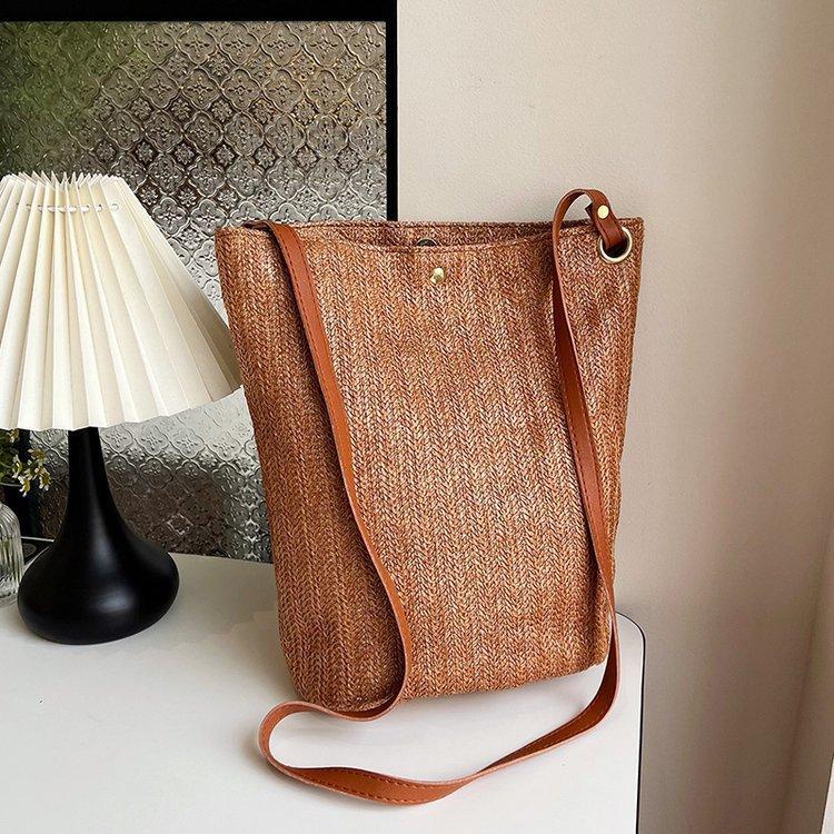 编织包女包新款潮2024夏草编简约百搭小清新水桶包个性单肩斜