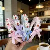 Diadema infantil linda caricatura Sanrio oso fresa accesorios para el cabello estilo coreano nueva diadema para niñas venta al por mayor tienda de dos yuanes