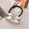 Estilo punk europeo y americano metal personalidad alta calidad cuerda para la cabeza semicírculo tubo redondo anillo para el pelo cuerda elástica para el pelo Balot fabricantes al por mayor