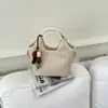 Bolso de tejido de alta gama de nicho para mujer, nuevo bolso cruzado versátil de moda 2026, bolso de mano exquisito, bolso tipo cubo