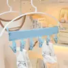 Cabide portátil dobrável com prendedor para pendurar meias e roupas íntimas, ideal para secar roupas em viagens.