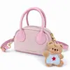 Mini Bolsa de Mão Infantil com Pingente de Ursinho Fofo Bolsa Transversal para Menina Acessórios Estilo Retro Coreano Estampa de Leopardo Bolsa Pequena