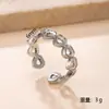 Anillo de Botón Hueco Nuevo Europeo y Americano Colorido Simple Moda Prensado en Aceite Corazón Geométrico Anillo de Acero Inoxidable Joyería
