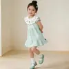 Verano 2026 Nuevo Vestido de Pastel Bordado Color Menta Dopamina Cuello de Muñeca Vestido para Niñas Ropa Infantil Al por Mayor