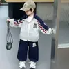 Traje para Niños Estilo Primavera y Otoño 2026 Nuevo Conjunto de Dos Piezas de Chaqueta Deportiva y Pantalones para Niño Pequeño y Joven Tendencia