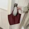 Nuevo diseño de nicho estilo coreano, versátil para el trabajo, cuero suave, retro, gran capacidad, bolso para madre e hijo, bolso de mano para mujer, se puede llevar en la mano o colgar al hombro